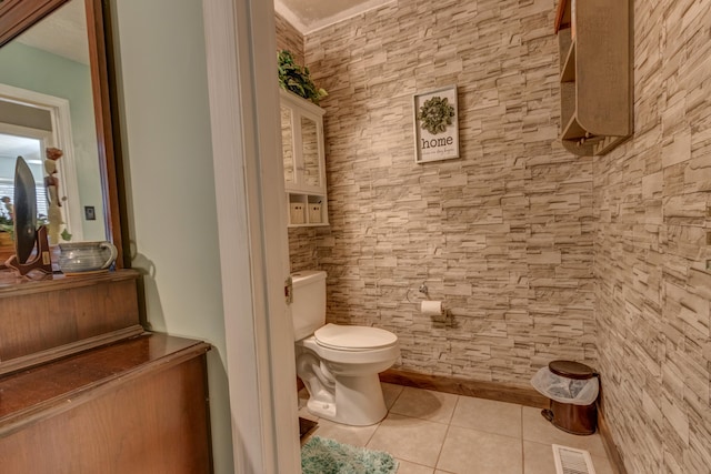 bathroom featuring toilet and tile patterned flooring