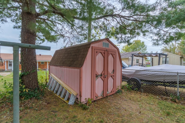 view of outbuilding featuring a pergola