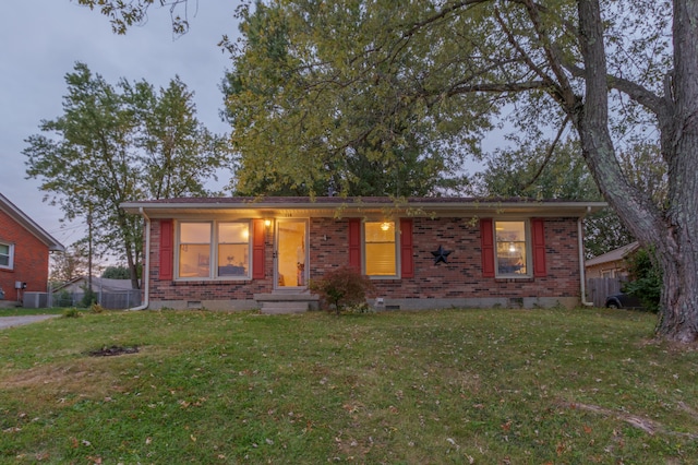 ranch-style house with a front lawn