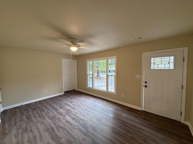 foyer entrance with ceiling fan and dark hardwood / wood-style flooring