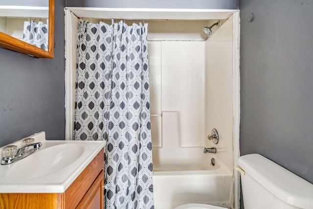 full bathroom featuring shower / tub combo, vanity, and toilet