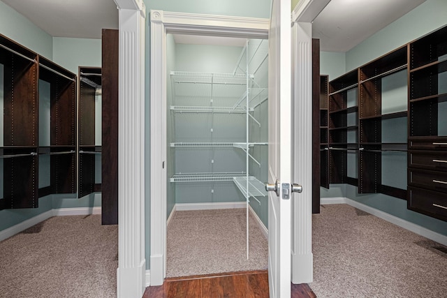 walk in closet featuring carpet