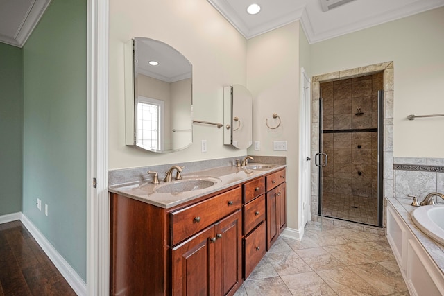 bathroom with ornamental molding, vanity, and plus walk in shower