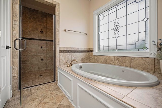 bathroom with shower with separate bathtub