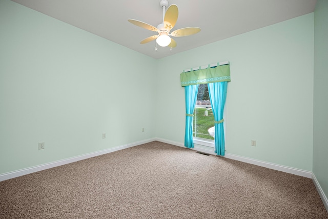 carpeted empty room with ceiling fan