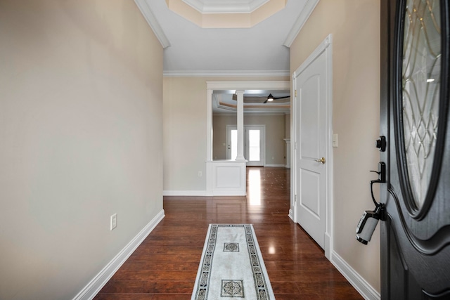 interior space with dark hardwood / wood-style floors and crown molding