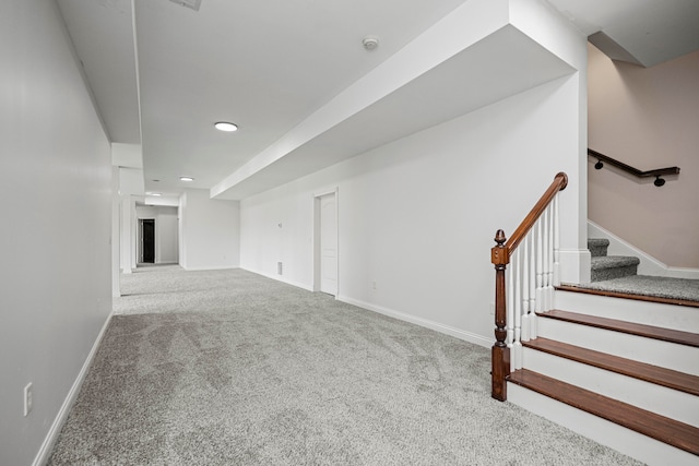 unfurnished living room featuring carpet floors