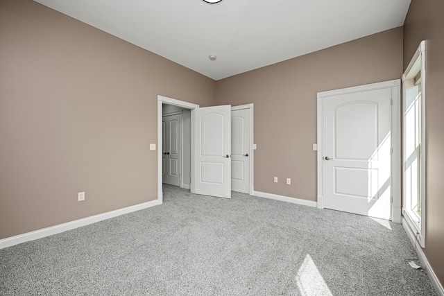 unfurnished bedroom featuring carpet flooring