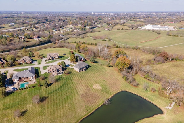 drone / aerial view with a water view and a rural view