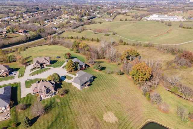 birds eye view of property featuring a rural view and a water view