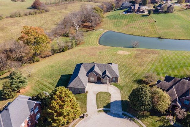 aerial view with a rural view and a water view