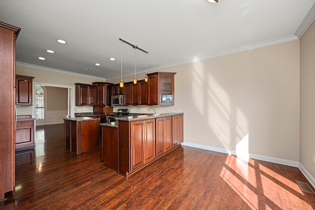 kitchen featuring a kitchen island, hanging light fixtures, stainless steel appliances, and dark wood-type flooring