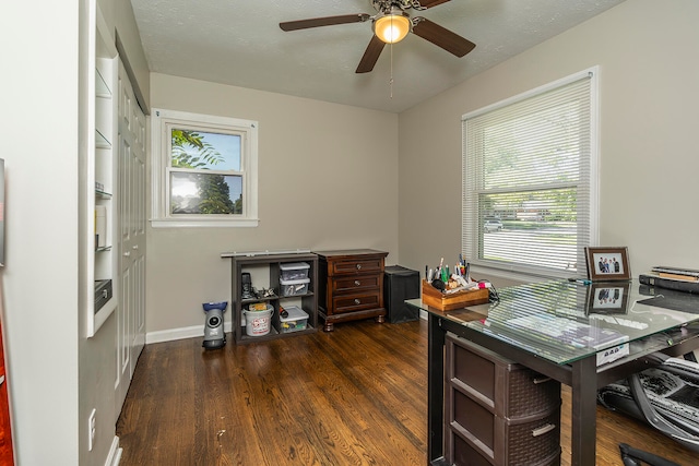 office with ceiling fan, dark wood-type flooring, and a textured ceiling