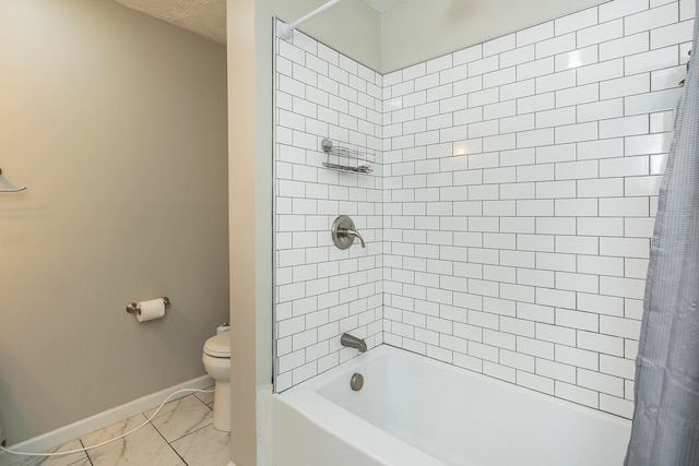 bathroom with shower / bath combo and toilet