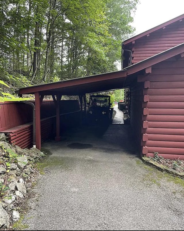 view of parking / parking lot with a carport