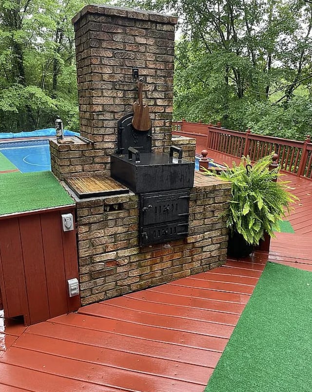 wooden deck with a swimming pool