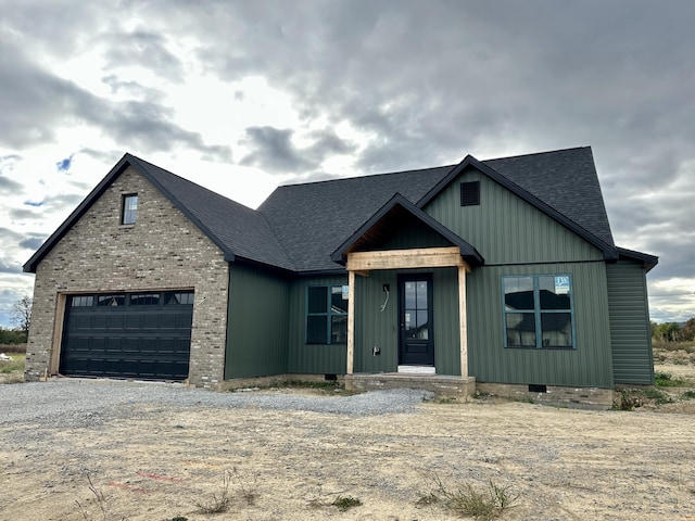 view of front of property with a garage