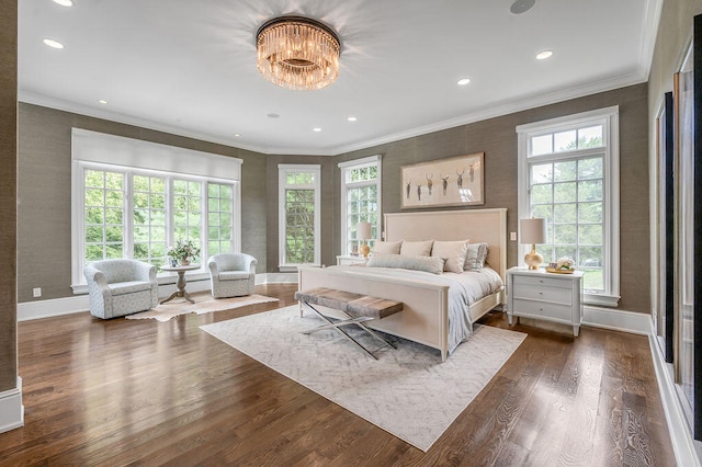 bedroom featuring ornamental molding, multiple windows, and dark hardwood / wood-style floors