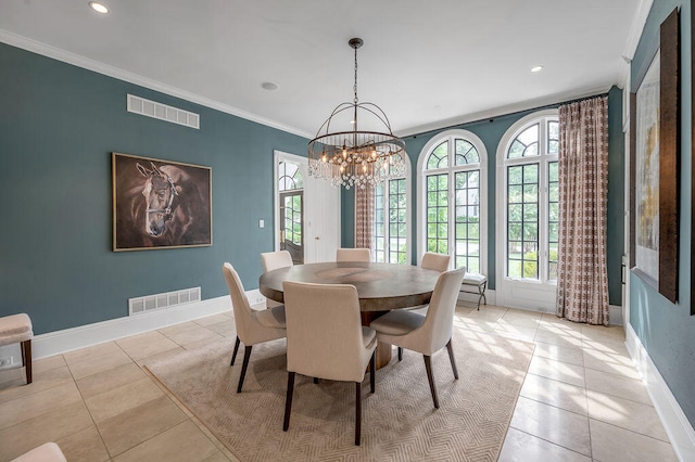 dining area featuring an inviting chandelier, crown molding, a healthy amount of sunlight, and light tile patterned floors