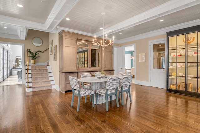 dining area featuring beamed ceiling, crown molding, wooden ceiling, and dark wood-type flooring