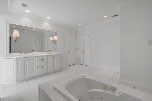 bathroom with vanity, crown molding, tile patterned flooring, and tiled tub