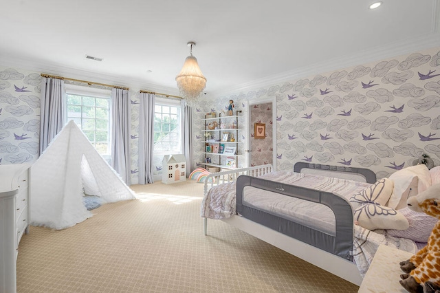 carpeted bedroom with crown molding and a chandelier