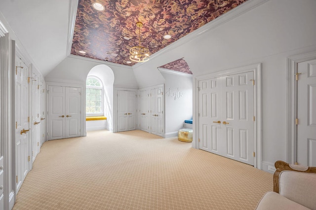 additional living space featuring light carpet and lofted ceiling