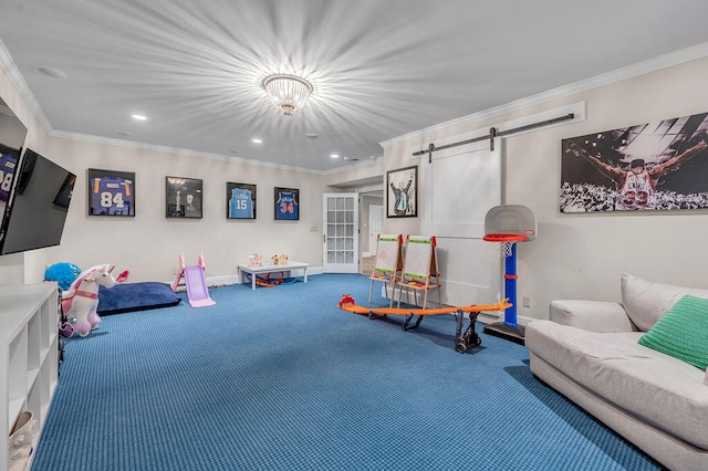 game room featuring ornamental molding, a barn door, and carpet