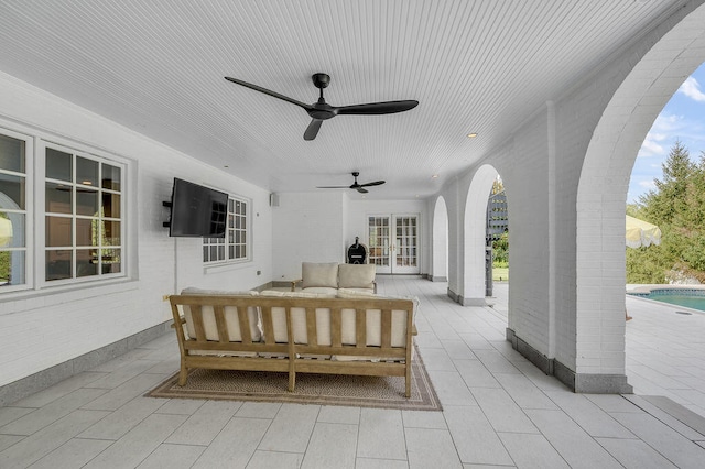 view of patio featuring french doors, outdoor lounge area, and ceiling fan