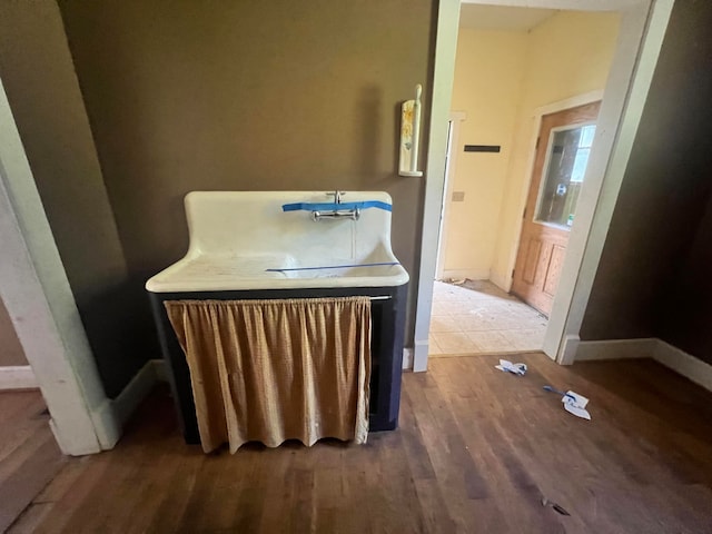 bathroom with hardwood / wood-style flooring