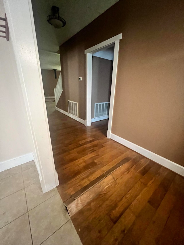 hallway with wood-type flooring