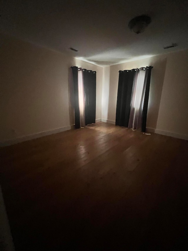 unfurnished room featuring wood-type flooring