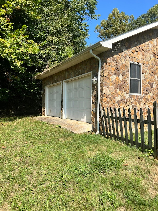 garage with a yard