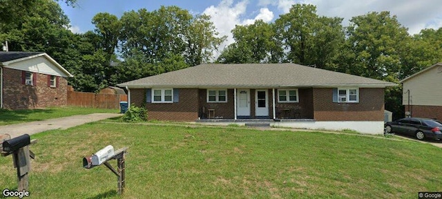 single story home featuring a front yard