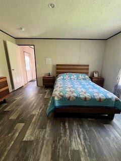 bedroom featuring dark wood-type flooring and a textured ceiling