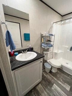 bathroom with wood-type flooring, toilet, vanity, and a shower with curtain