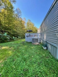 view of yard with a wooden deck