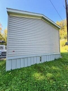 view of side of property with a yard