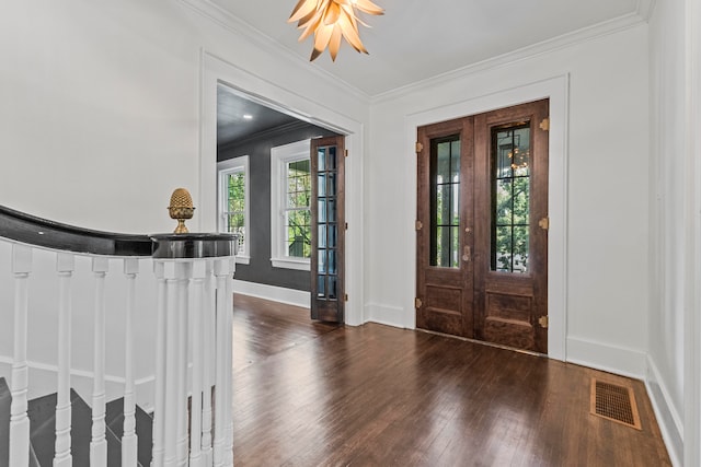 foyer with ornamental molding, french doors, and dark hardwood / wood-style floors