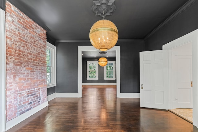 unfurnished dining area featuring crown molding and dark hardwood / wood-style floors