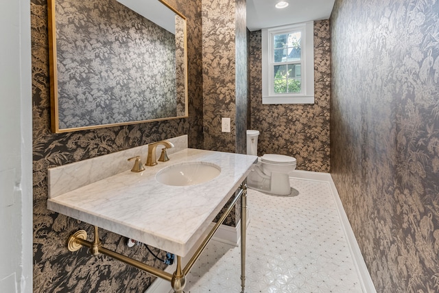 bathroom with vanity and toilet