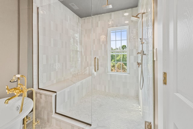 bathroom featuring separate shower and tub and tile walls