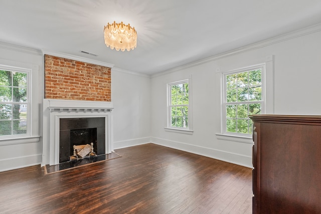 unfurnished living room with a fireplace, dark hardwood / wood-style floors, and crown molding