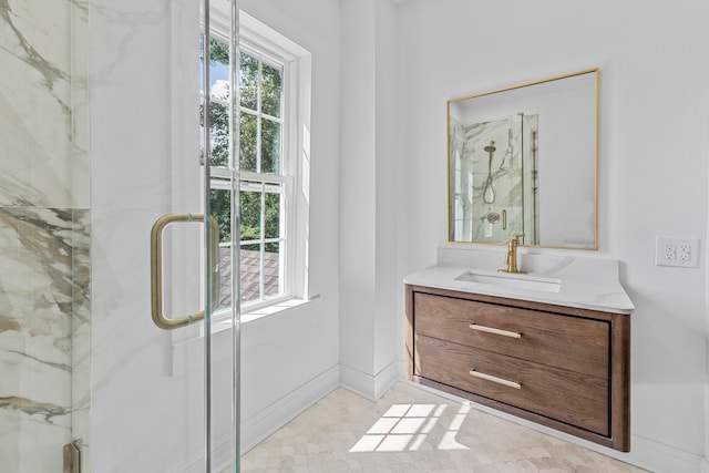 bathroom with vanity and a shower with shower door