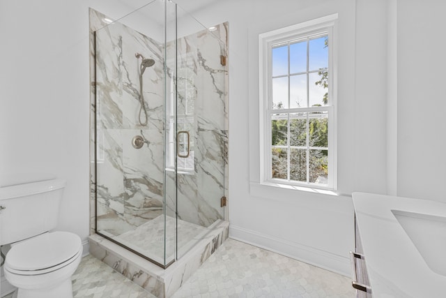 bathroom featuring vanity, toilet, an enclosed shower, and tile patterned floors