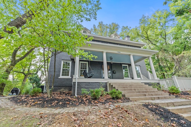 view of front of property featuring covered porch