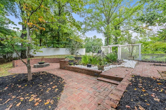 view of patio / terrace with a fire pit