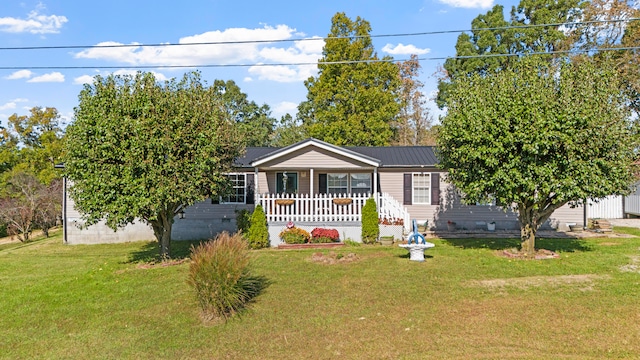 single story home featuring a front lawn and covered porch