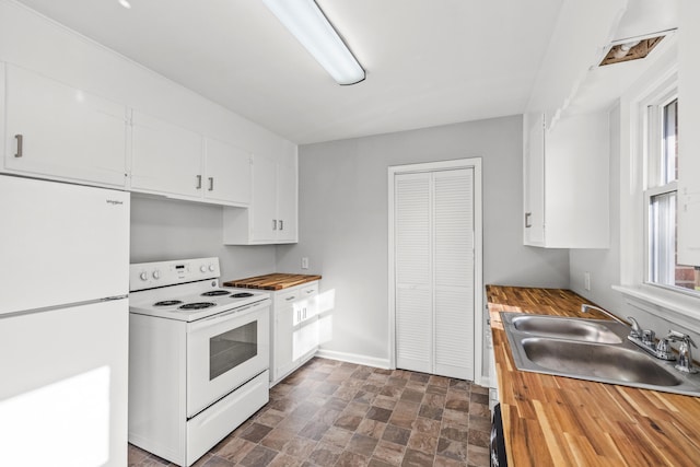 kitchen featuring white cabinets, wooden counters, sink, and white appliances