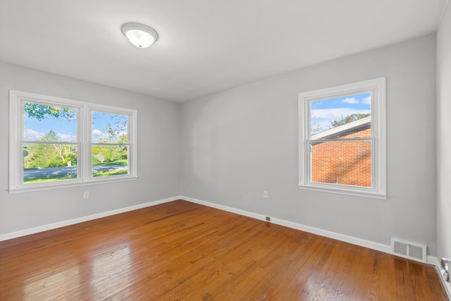 spare room featuring hardwood / wood-style flooring